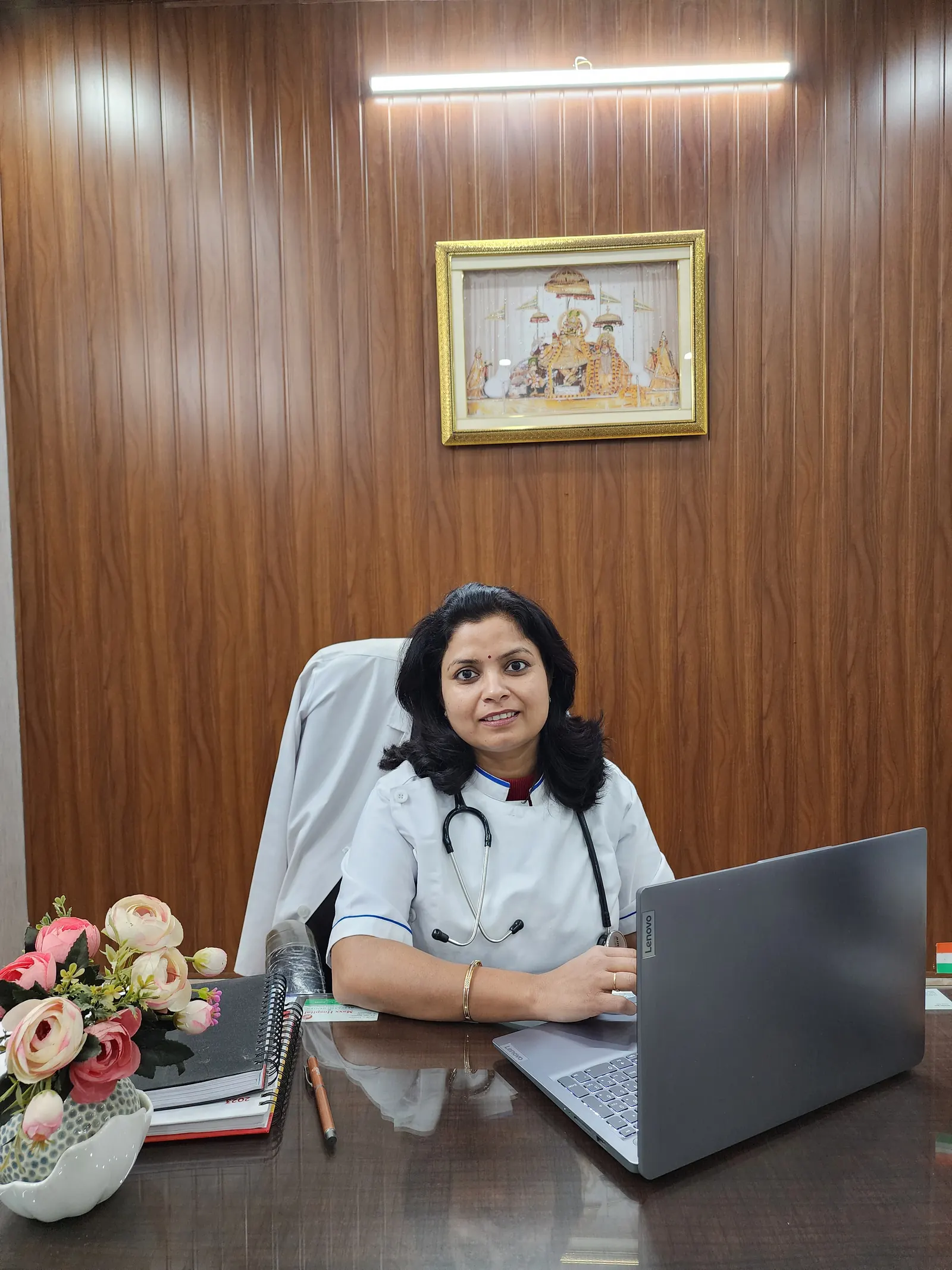 Dr. Jahanvi Tyagi seated at her desk in the consultation room